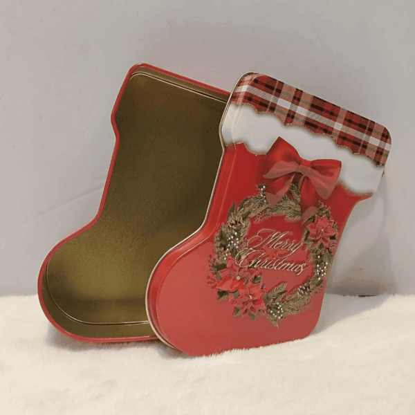 Festive stocking-shaped  storage tin for gifts.