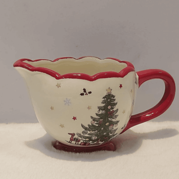 1760615372_Web_image_31_1-1.png Christmas-themed creamer with festive design.