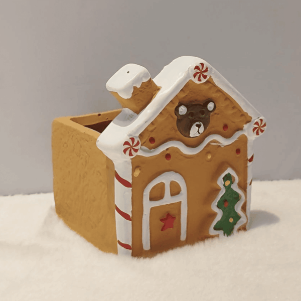 1760679603_Web_image_37_1-1.png Adorable Gingerbread House Planter Decor