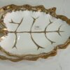 1781247878_WhatsApp_Image_2026-06-09_at_13.20.58-1.jpeg Leaf-Shaped White Ceramic Serving Dish with Gold Vein Detailing