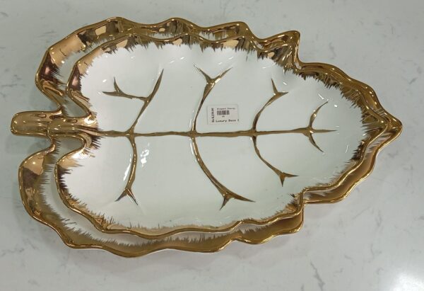 1781247878_WhatsApp_Image_2026-06-09_at_13.20.58-1.jpeg Leaf-Shaped White Ceramic Serving Dish with Gold Vein Detailing
