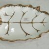 1781247883_WhatsApp_Image_2026-06-09_at_13.21.57-1.jpeg Leaf-Shaped White Ceramic Serving Dish with Gold Vein Detailing