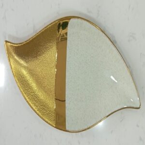1781615363_WhatsApp_Image_2026-06-09_at_13.16.31-rotated-1.jpg Leaf-Shaped Ceramic Serving Dish with White and Textured Gold Finish