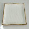 1781616252_WhatsApp_Image_2026-06-09_at_13.20.42-1.jpg Textured Square Ceramic Serving Dish with Gold Rim
