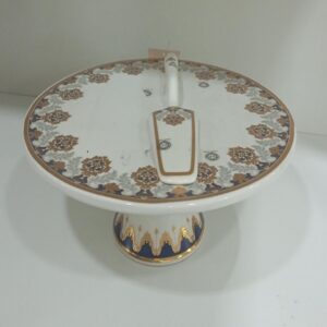 1781618560_WhatsApp_Image_2026-06-06_at_17.10.44-1.jpg Ceramic pedestal cake stand with a cake server