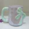 1781946785_WhatsApp_Image_2026-06-18_at_10.07.37_1-1.jpeg Elegant Pastel Bow Ceramic Mug