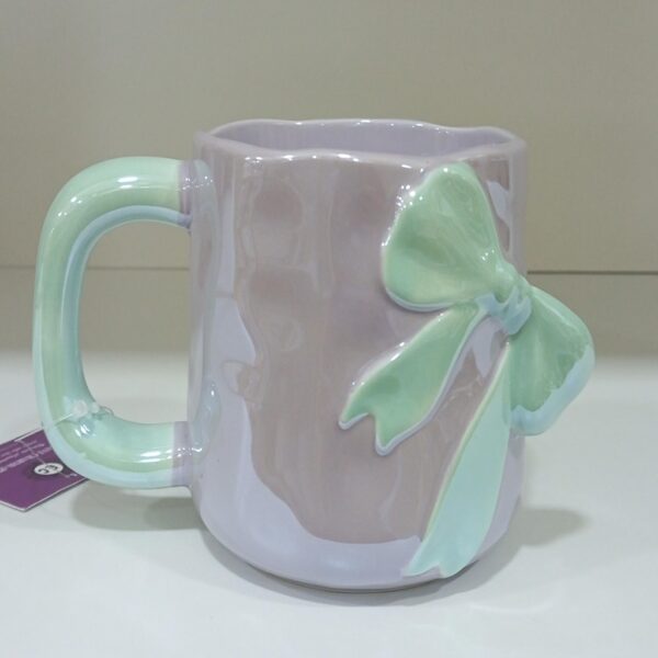 1781946785_WhatsApp_Image_2026-06-18_at_10.07.37_1-1.jpeg Elegant Pastel Bow Ceramic Mug