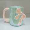 1781946786_WhatsApp_Image_2026-06-18_at_10.07.37-1.jpeg Elegant Pastel Bow Ceramic Mug