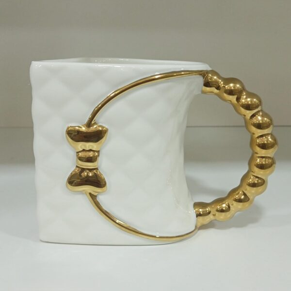 1782126417_WhatsApp_Image_2026-06-16_at_07.15.07_1-1.jpeg Bow Accent Luxury Ceramic Mug