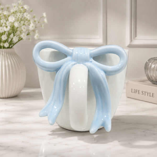 1787139565_Pastel_Blue_Bow_Mug_Still_Life-1.png Charming Bow Accent Ceramic Mug